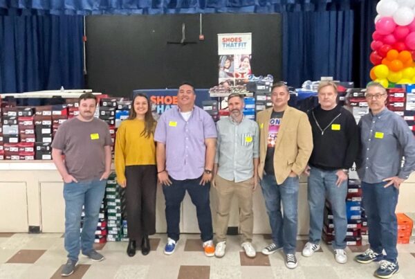 Dan Dressel and friends pose with new shoes for Felton Elementary kids